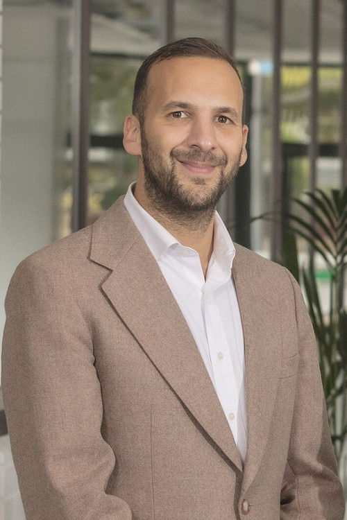 Zack Polanski as Travis Carter