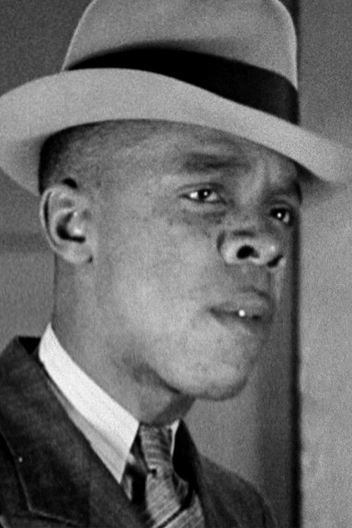 Edwin Cary as Conrad, the numbers man