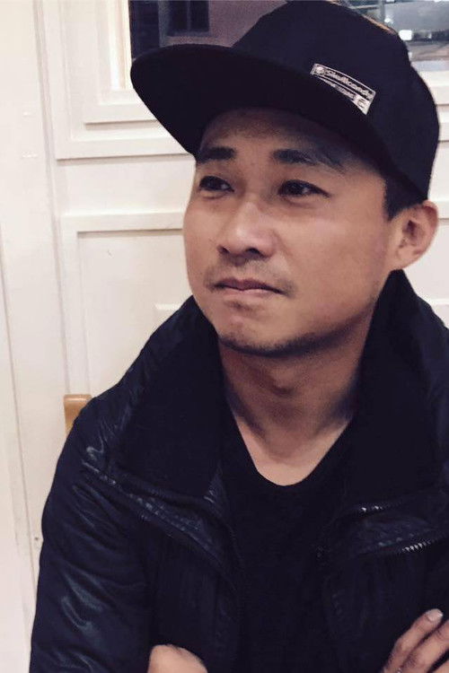 Tommy Yu as Man at Beach