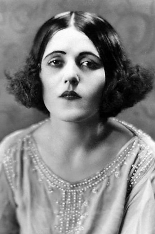 Zalla Zarana as Woman in Zanzibar Bar (uncredited)