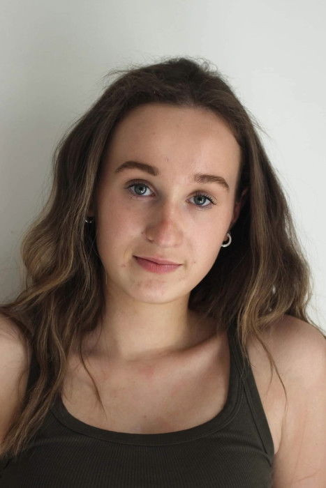 Anna Giddings as Featured extra