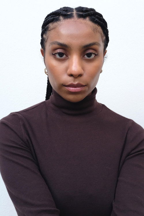 Kiah Butts as Kiah - Executive Secretary