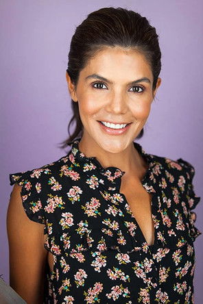 Michelle Alegria as News Anchor