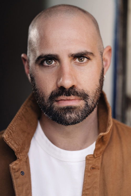 Dean Graham as Hamza the Guitarist