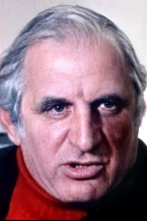 Ettore Martini as Shooting Gallery Owner