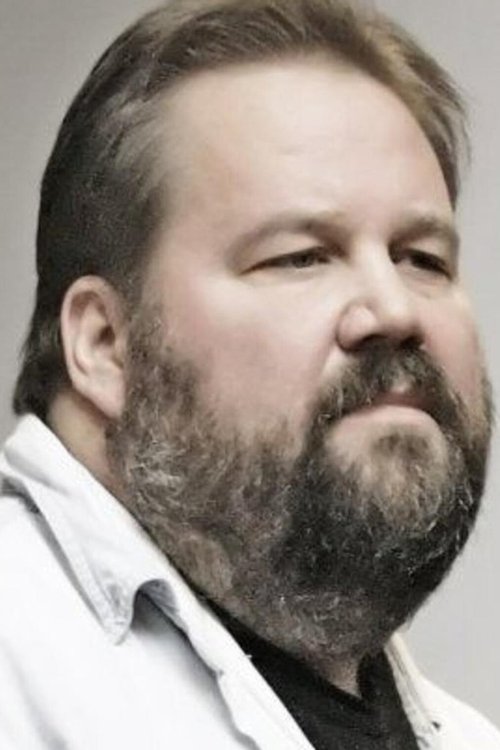 Lance Norris as The Mechanic