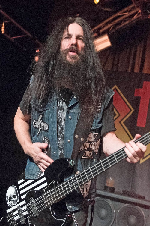 John DeServio as Bass