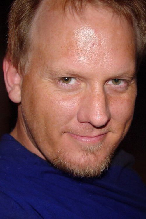 Erik Hollander as Newscaster