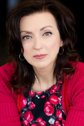 Estelle Esse as Leather shop clerk