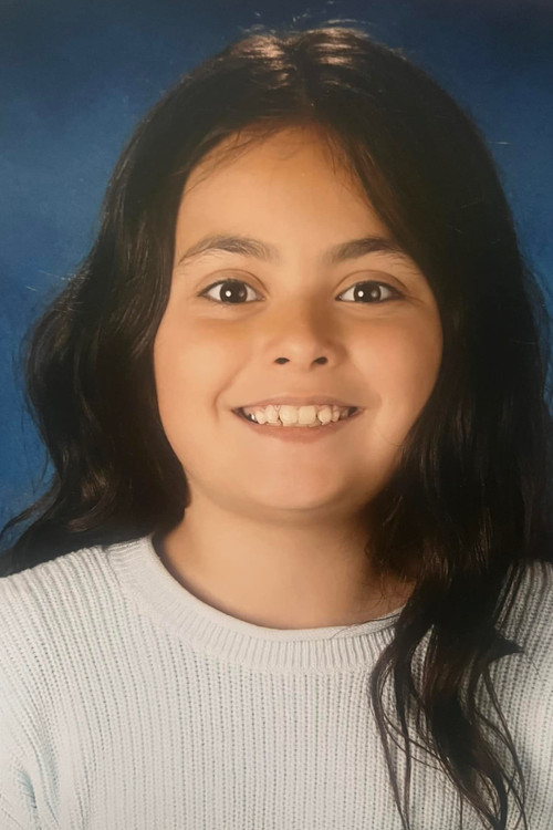 Maggie Lazo as Child In Park