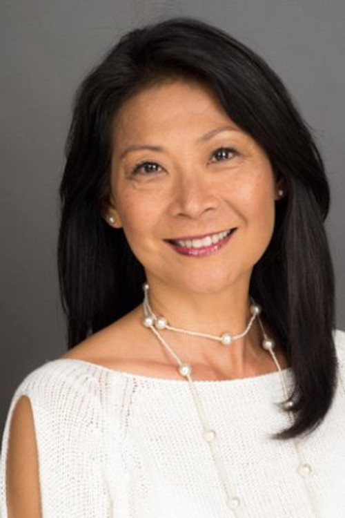 Mung-Ling Tsui as Travel Agent