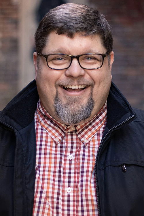 Robb Smith as News Broadcaster (voice)