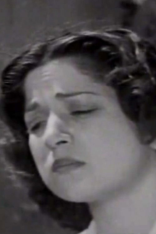 Ora Vaza as Zisis' wife