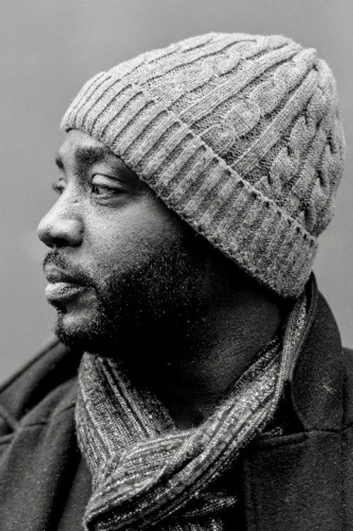 Alrick Brown as Man on Train