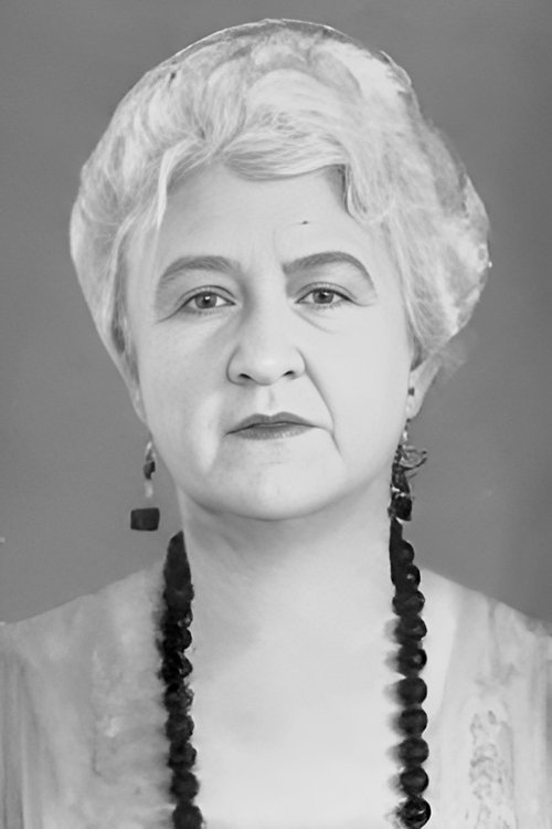 Maude Turner Gordon as Mrs. Reynolds