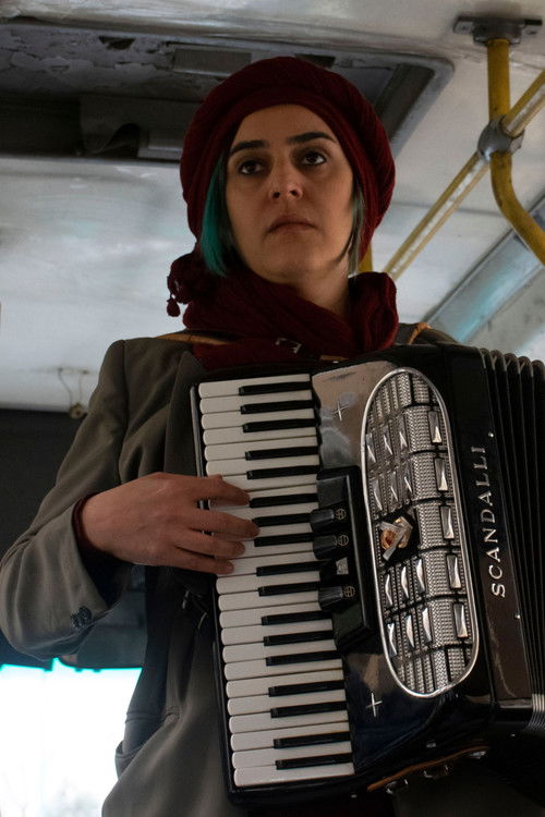Neda Asef as the musician