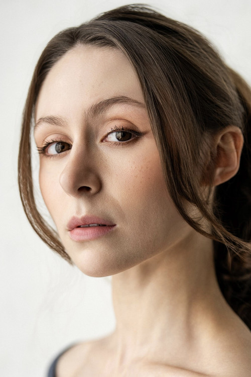 Courtney Mirelle as Newscaster