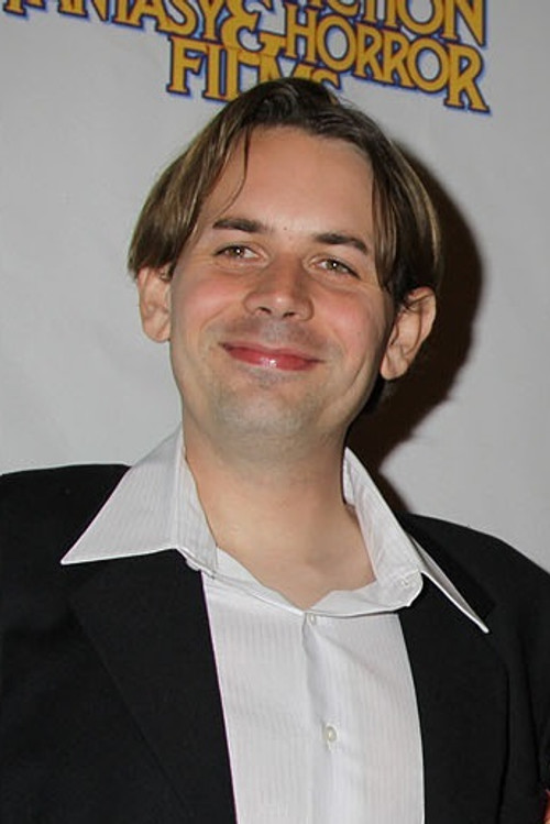 Andrew Kasch as The Resident