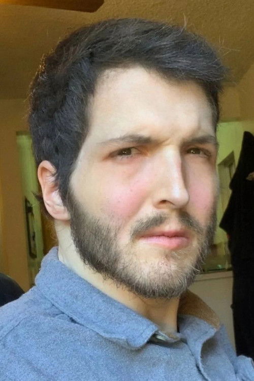 Zach Hadel as Reggie Paloni (voice)