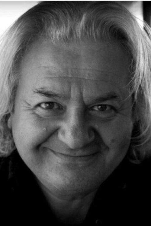 Sasha Diamandi as The Footman