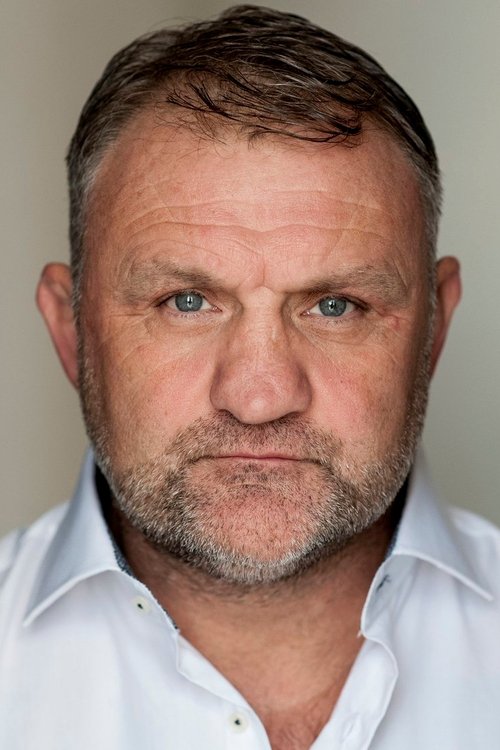 Mark Sheals as Cock Fight Referee