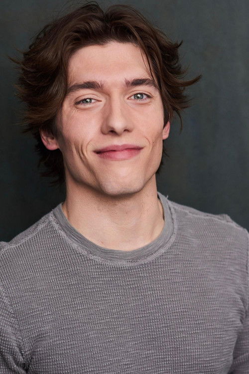 Ben Armstrong as Travis