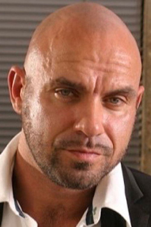 Axel Ryder as Worker in Blue Overall