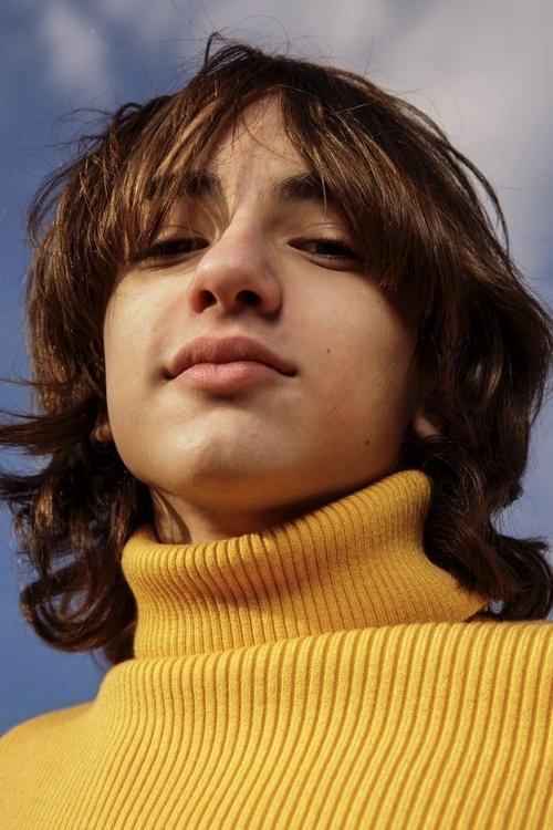 Azhy Robertson as Johnny Benson