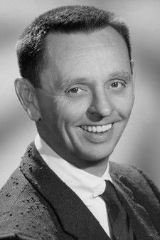 Knox Manning as Radio Announcer