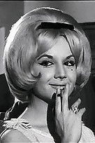 Conchita Núñez as Margot / the waitress (uncredited)