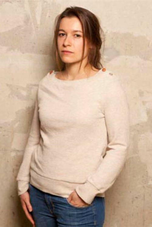 Alice Douard as Voice of Radio Advertisement