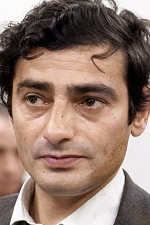 Charles Denner as Counterfeiter (segment "Le Grand escroc")