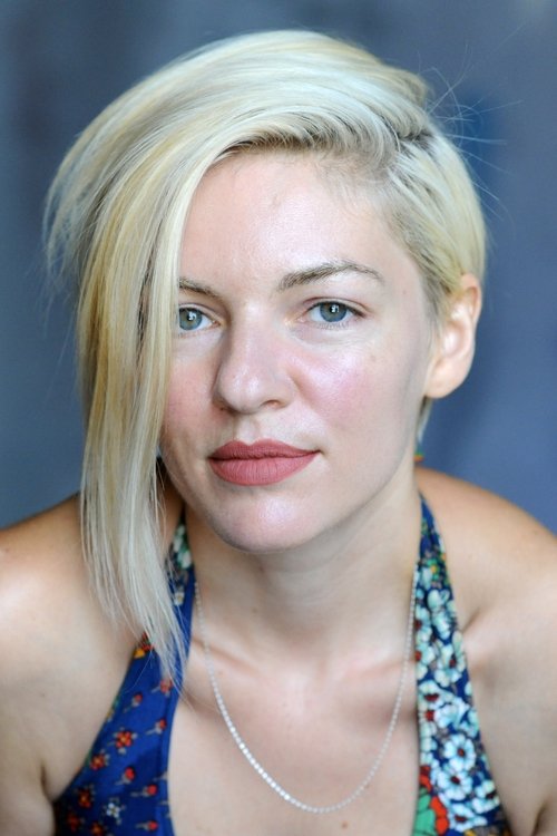 Oana Maria Zaharia as Blonde Nudist Parent