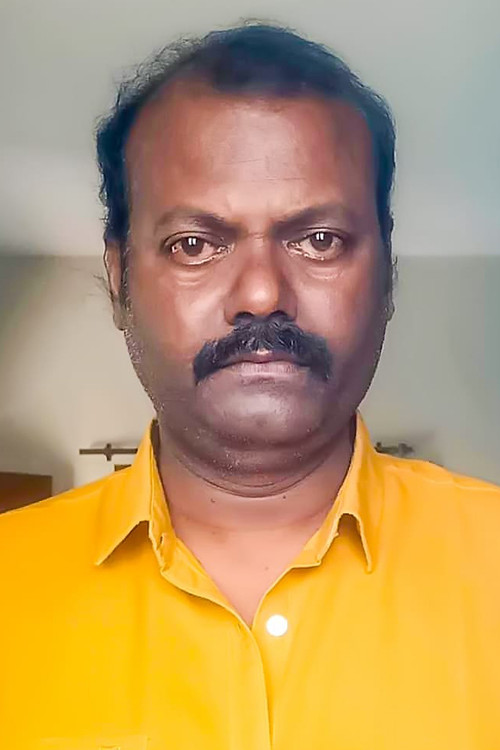 M Karthikesan as 