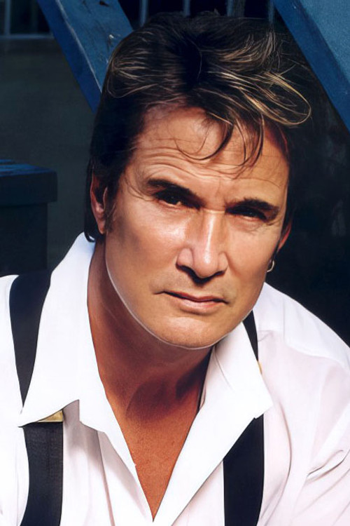 Richard Norton as Tom 'Snake' Sasso