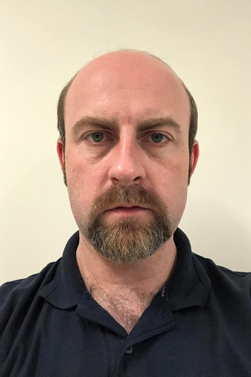 Liam Finlayson as Man in Red