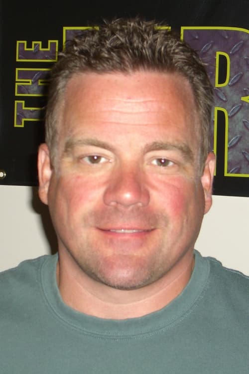 John G. Brennan as Himself / Frank 'Rubberneck' Rizzo