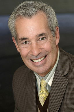 Michael Coons as Father Tom Alexander