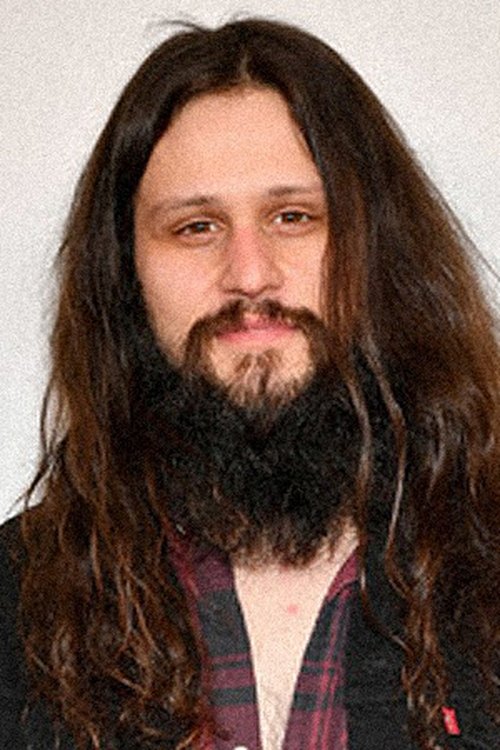 Joe Begos as Channel 2 Anchor