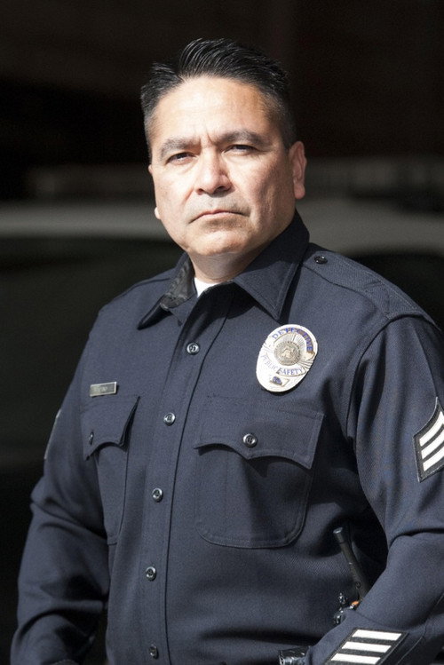 Chris Cano as Police Officer