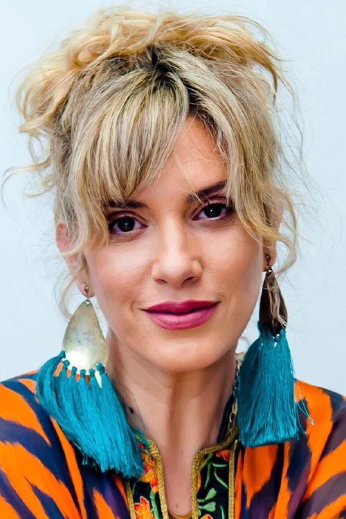 Sylvia Delikoura as 