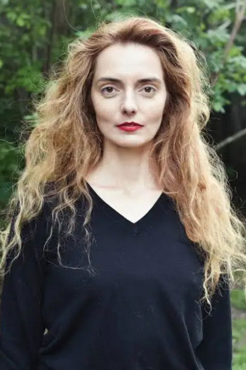 Olivia Csiky Trnka as The blonde haired Girl