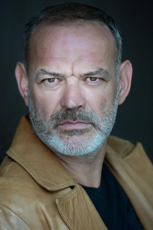 Alexander John as Priest