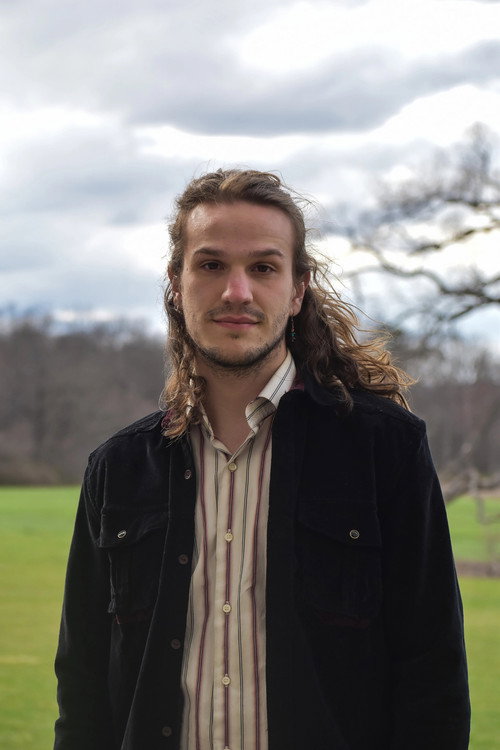 Shane Troxell as August