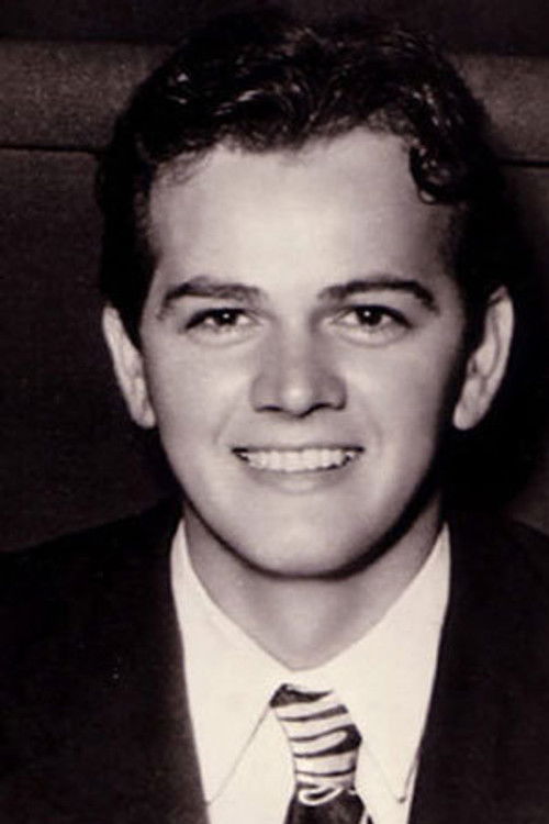 John Deauville as Cloakroom Attendant (uncredited)