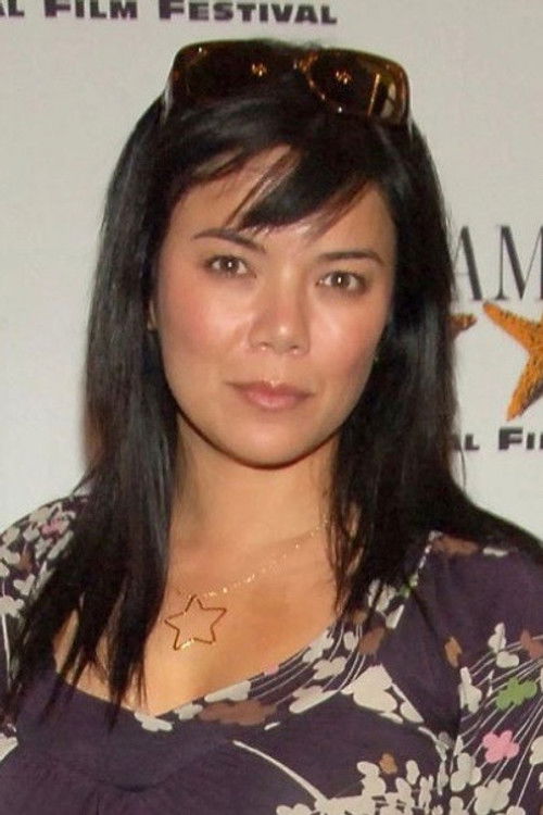 Allison Sie as De La Cruz