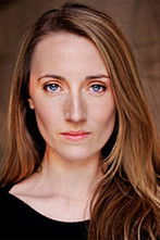 Liz Strange as Spokeswoman