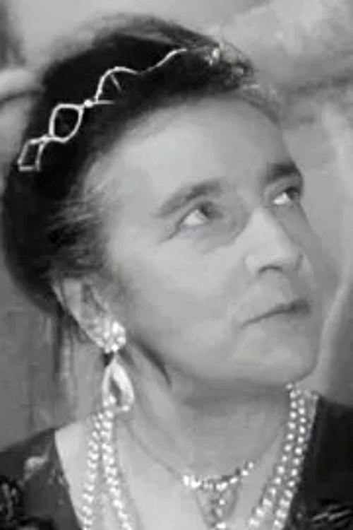 Julienne Paroli as La bigote