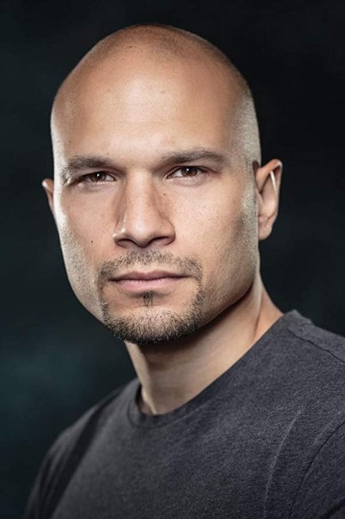 Sonny Louis as Vee 'The Postman'