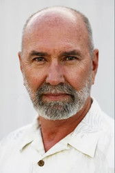 John Pritchett as Hotel Desk Clerk